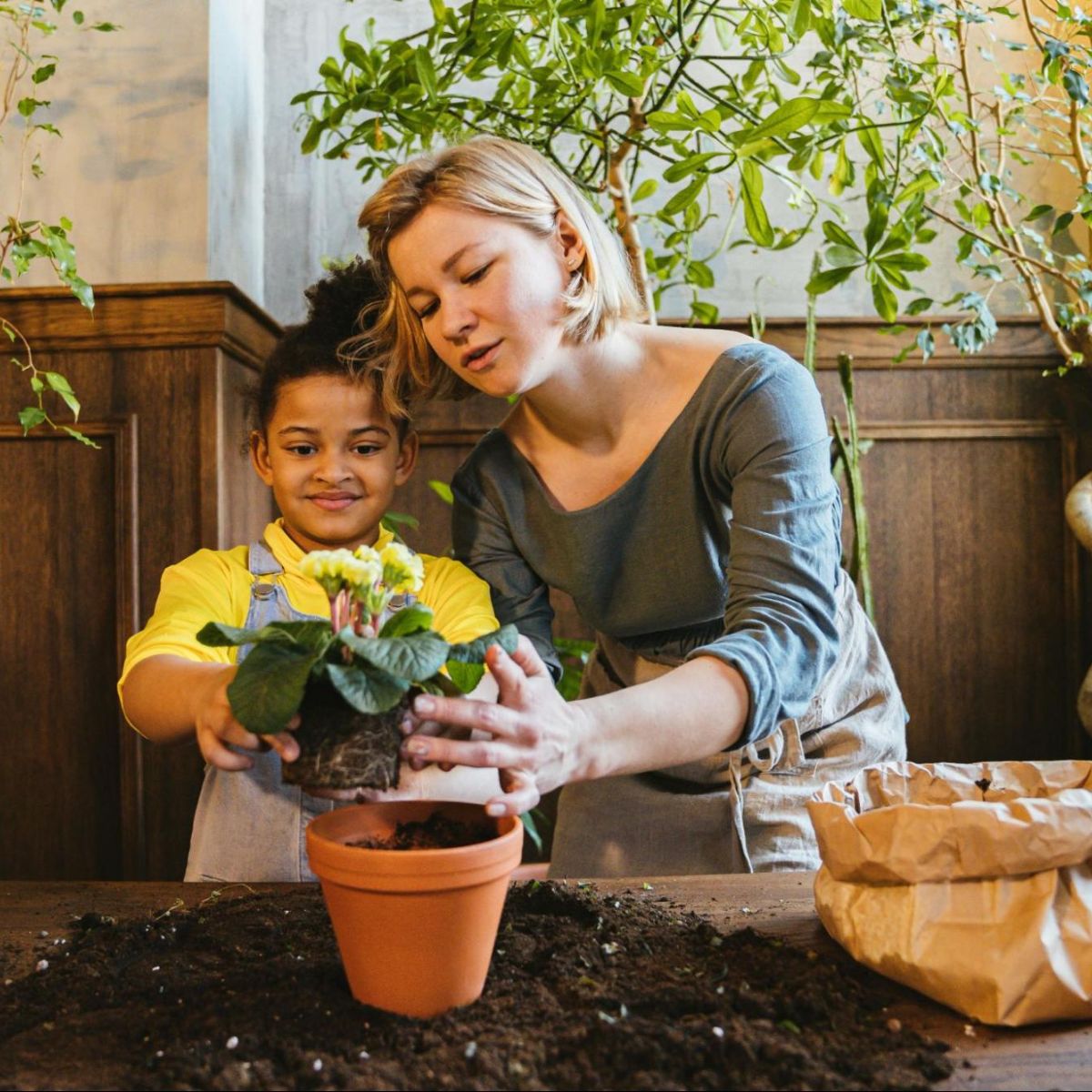 Woman and child planting flowers
