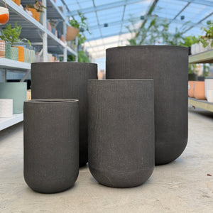 Northcote Pottery Altus U Pot Black Pot Plant Set planters in an indoor plant nursery in melbourne