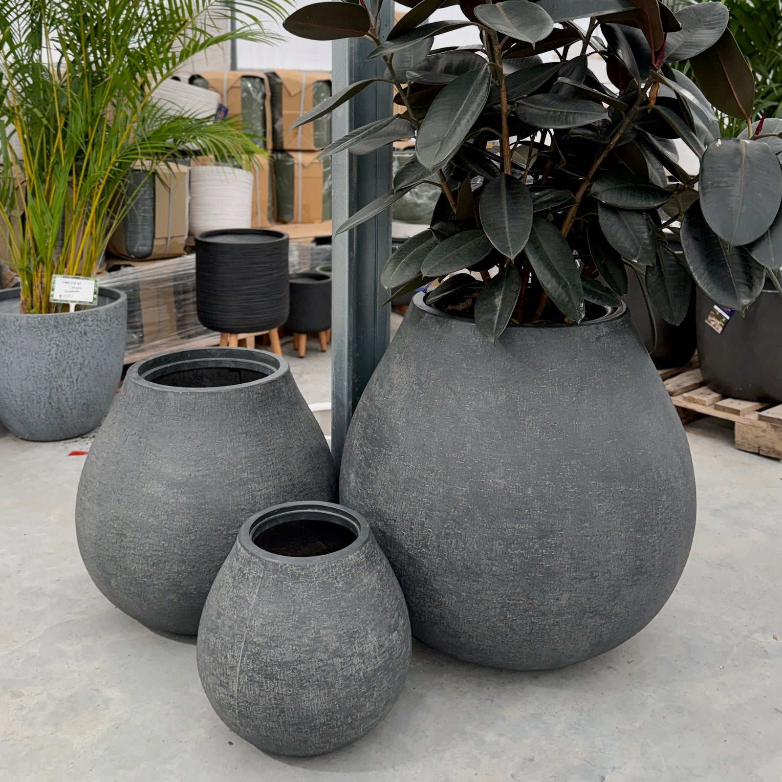 Three teardrop shaped pot planters in charcoal 