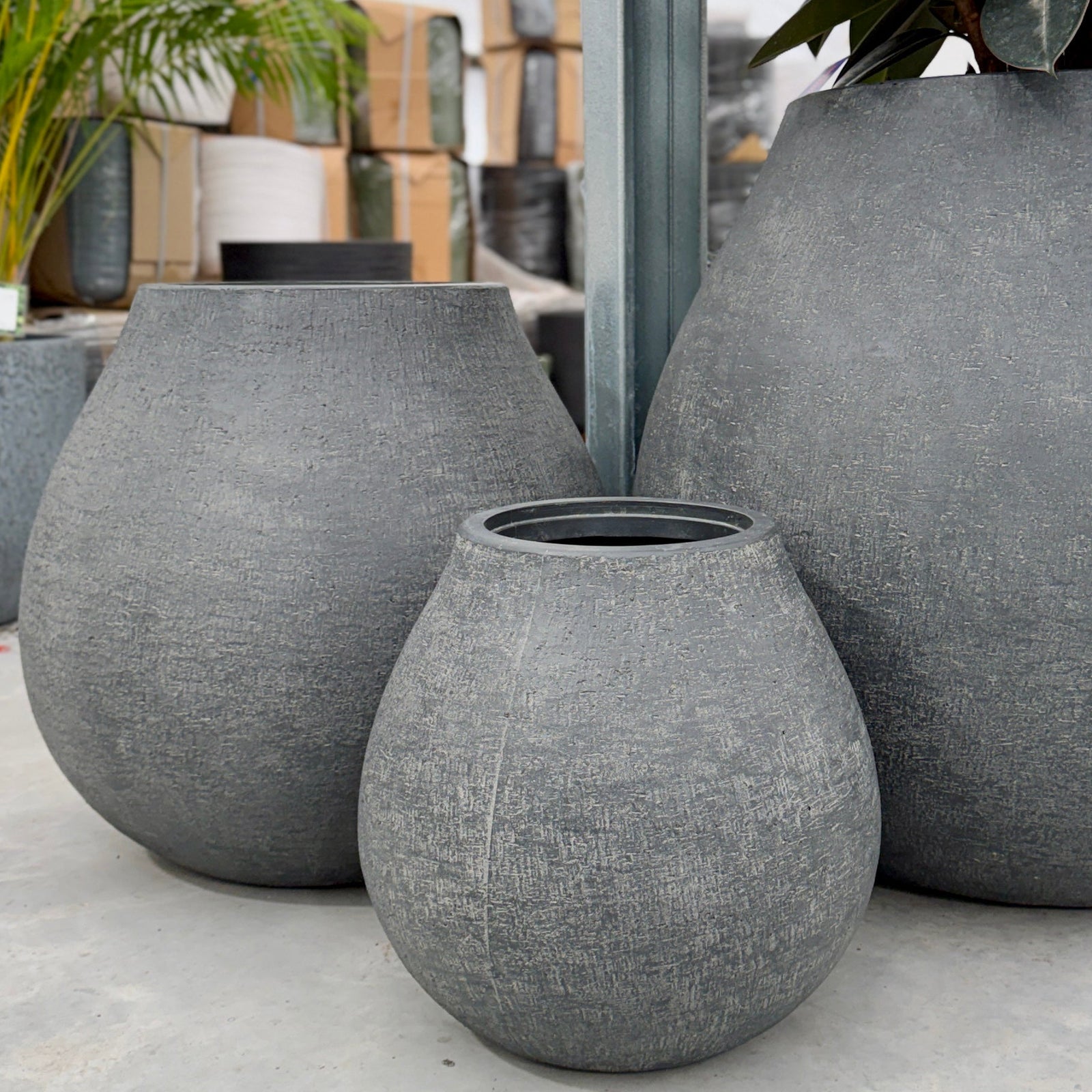 Three teardrop shaped pot planters in charcoal 