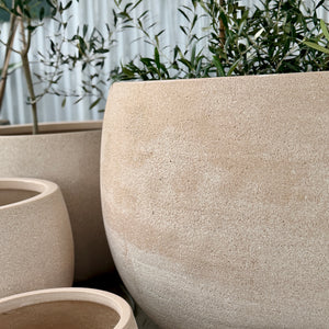 Close up of Mega Belly Lava Beige pots 