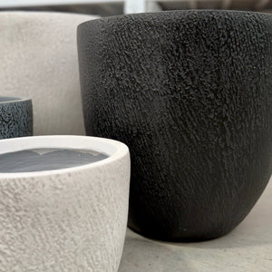Close up of the texture of Northcote Pottery Slate Egg pots in Black and White 