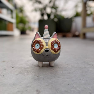 Small animal head plant pot with party hat and donut glasses