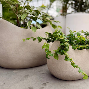 Close up of the texture of Vellum Rock Beige planters. 